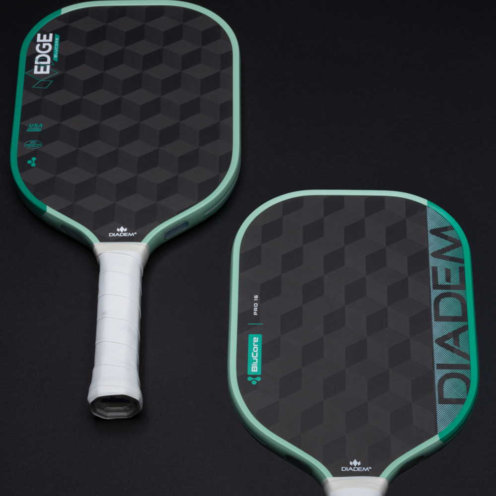 Two pickleball paddles with 'EDGE' and 'DIADEM' branding on a black background