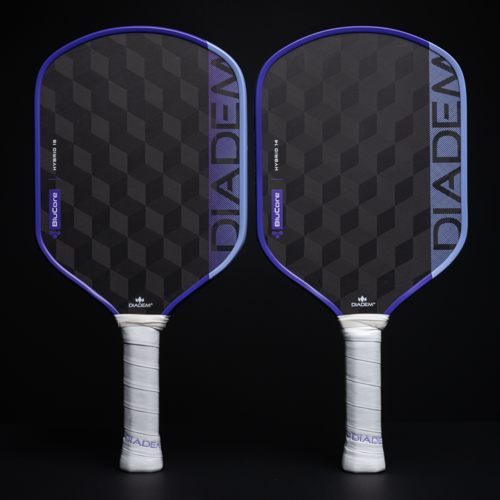 Two pickleball paddles with black and purple design on a black background