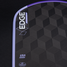 Close-up of a black and purple sports equipment with 'EDGE' branding on a dark background