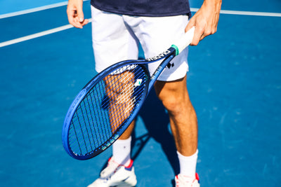 tennis player stands with elevate v3 racket diadem sports